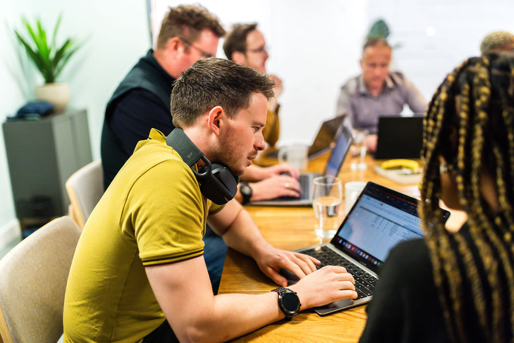 Flex Digital Bristol SEO agency team working on their laptops