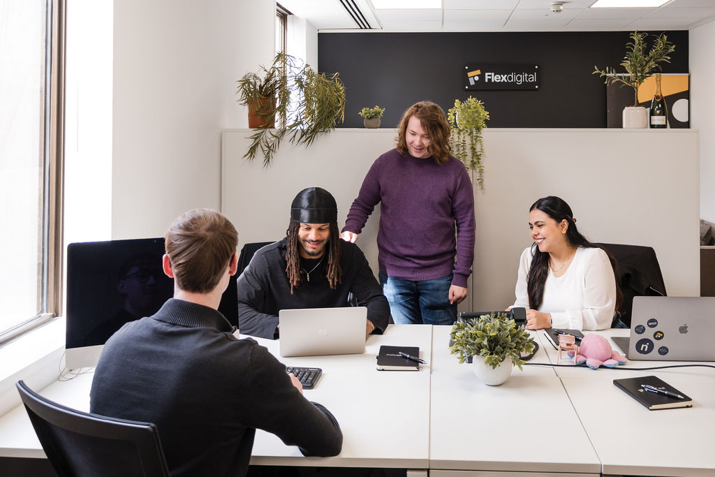 Team of digital marketing experts working in the Flex Digital office